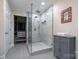 Modern bathroom features a glass enclosed shower and a walk in closet at 9820 Janeiro Dr, Huntersville, NC 28078