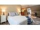 Cozy bedroom features a comfortable bed and accent chair by a bright window at 9820 Janeiro Dr, Huntersville, NC 28078