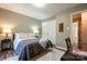 Cozy bedroom featuring neutral walls, a comfortable rug, and a closet for storage at 9820 Janeiro Dr, Huntersville, NC 28078