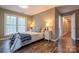 Comfortable bedroom features a cozy bed and bright windows offering natural light at 9820 Janeiro Dr, Huntersville, NC 28078