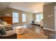 Bright, cozy bedroom with large windows, accent chairs, and comfortable bed at 9820 Janeiro Dr, Huntersville, NC 28078