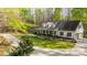 Inviting two-story home featuring a charming front porch, well-manicured lawn, and attached garage at 9820 Janeiro Dr, Huntersville, NC 28078
