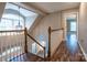 Elegant foyer hallway with wood floors, staircase, and a chandelier at 9820 Janeiro Dr, Huntersville, NC 28078