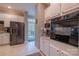 Well-equipped kitchen with stainless steel appliances, white cabinetry and a view to the deck at 9820 Janeiro Dr, Huntersville, NC 28078