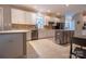 Spacious kitchen with white cabinets, stainless steel appliances, and an island with seating at 9820 Janeiro Dr, Huntersville, NC 28078