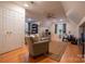 Spacious living area with hardwood floors, neutral walls, and bright windows at 9820 Janeiro Dr, Huntersville, NC 28078