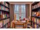 Cozy office space featuring bookshelves, a desk, and natural light at 9820 Janeiro Dr, Huntersville, NC 28078