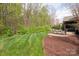 Manicured backyard with established landscaping and patio spaces great for outdoor entertainment at 11308 Wheat Ridge Rd, Charlotte, NC 28277