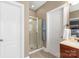 Bathroom featuring glass enclosed shower, wood vanity with sink, and tile floors near the water closet at 11308 Wheat Ridge Rd, Charlotte, NC 28277