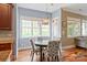 Cozy breakfast nook adjacent to kitchen, featuring a round table and bright windows at 11308 Wheat Ridge Rd, Charlotte, NC 28277