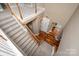 Grand foyer featuring a staircase, modern chandelier, and hardwood flooring at 11308 Wheat Ridge Rd, Charlotte, NC 28277