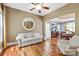 Inviting living room with hardwood floors, neutral walls, and seamless access to the dining area at 11308 Wheat Ridge Rd, Charlotte, NC 28277