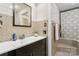 Bathroom with modern sink, vanity, mirror, and shower-tub combo at 1197 Fincher Rd, Fort Lawn, SC 29714