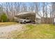 Carport with a truck and a boat parked on a gravel surface at 1197 Fincher Rd, Fort Lawn, SC 29714