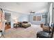 Spacious living room featuring neutral carpet, ceiling fan, and abundant natural light from the window at 1197 Fincher Rd, Fort Lawn, SC 29714
