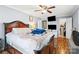 Spacious main bedroom featuring hardwood floors, ceiling fan, closet access, and plentiful storage at 1197 Fincher Rd, Fort Lawn, SC 29714