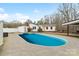 Backyard view showcasing the sparkling in-ground pool and surrounding patio space at 1197 Fincher Rd, Fort Lawn, SC 29714