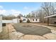 Backyard view showcasing the in-ground pool covered by safety net at 1197 Fincher Rd, Fort Lawn, SC 29714