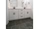 A modern bathroom with double vanity and slate floors at 1204 Sage Pine Cir, York, SC 29710