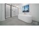 Modern bathroom with a freestanding tub, walk-in shower, and stylish fixtures at 1204 Sage Pine Cir, York, SC 29710