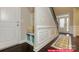Inviting entryway featuring built-in bench and dark wood floors, leading to the main living area at 122 Fordingbridge Ln, Mooresville, NC 28115
