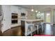 Gourmet kitchen with granite countertops, stainless steel appliances, and a center island with seating at 122 Fordingbridge Ln, Mooresville, NC 28115