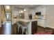 Bright and modern kitchen with granite island, stainless steel appliances, and an open layout at 122 Fordingbridge Ln, Mooresville, NC 28115