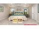 Inviting main bedroom with a tray ceiling, neutral color palette, and elegant decor at 122 Fordingbridge Ln, Mooresville, NC 28115