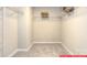 Empty walk-in closet featuring shelves and carpeted floor at 122 Fordingbridge Ln, Mooresville, NC 28115