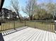 This spacious deck overlooks a sprawling backyard with mature trees and lush green grass at 12300 Eva St, Matthews, NC 28105