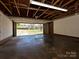 The home features a spacious garage with an open door that leads to the driveway at 12300 Eva St, Matthews, NC 28105
