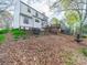 This home has a spacious backyard, wooden deck, and mature trees at 12708 Hollyhock Ln, Huntersville, NC 28078