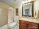Functional bathroom featuring vanity, toilet, shower, and neutral color scheme at 12708 Hollyhock Ln, Huntersville, NC 28078