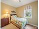 Cozy bedroom with a large window, wood floors and ample natural light at 12708 Hollyhock Ln, Huntersville, NC 28078