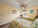 Inviting bedroom with twin beds, window, ceiling fan, and neutral decor at 12708 Hollyhock Ln, Huntersville, NC 28078