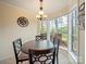 Charming breakfast nook with large windows offering a view of the deck and backyard at 12708 Hollyhock Ln, Huntersville, NC 28078