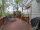Spacious wooden deck with seating offers a relaxing outdoor living space and scenic views at 12708 Hollyhock Ln, Huntersville, NC 28078