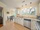 Eat-in kitchen with granite countertops, stainless steel appliances, and a seamless view to a dining nook at 12708 Hollyhock Ln, Huntersville, NC 28078