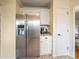 Kitchen area featuring a stainless steel refrigerator, granite counters, and direct access to the dining area at 12708 Hollyhock Ln, Huntersville, NC 28078