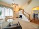 Bright living room with vaulted ceilings, elegant furnishings, and natural light streaming through windows at 12708 Hollyhock Ln, Huntersville, NC 28078
