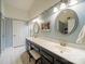 Bright main bathroom featuring dual sinks, sleek cabinets, and modern fixtures at 12708 Hollyhock Ln, Huntersville, NC 28078