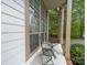 Inviting front porch with seating area offers a relaxing outdoor space to enjoy the neighborhood at 12708 Hollyhock Ln, Huntersville, NC 28078