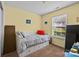 Cozy bedroom with a daybed, built-in drawers, and sunny window at 12804 Lismorre Castle Ct, Charlotte, NC 28273