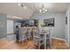 Open concept dining area next to kitchen with stylish bar stools and lots of natural light at 12804 Lismorre Castle Ct, Charlotte, NC 28273