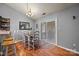 Cozy dining area adjacent to kitchen with hardwood floors and sliding glass doors to a deck at 12804 Lismorre Castle Ct, Charlotte, NC 28273
