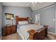 Comfortable main bedroom with a wooden bed frame, bedside tables, and carpeted flooring at 12804 Lismorre Castle Ct, Charlotte, NC 28273