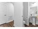 Bathroom with pedestal sink, toilet, and neutral decor at 1409 Augustus Beamon Dr, Indian Trail, NC 28079