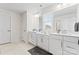 Bright bathroom featuring double sink vanity, modern fixtures, and neutral paint at 1409 Augustus Beamon Dr, Indian Trail, NC 28079