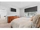 Comfortable bedroom featuring wood furniture, a mounted TV, and a window with outside view at 1409 Augustus Beamon Dr, Indian Trail, NC 28079