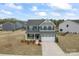 Beautiful two-story home featuring a well-manicured lawn and a spacious two-car garage at 1409 Augustus Beamon Dr, Indian Trail, NC 28079